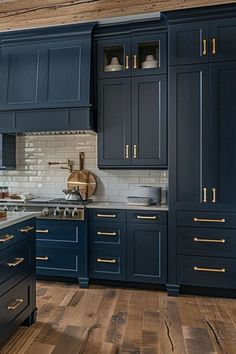 a kitchen with blue cabinets and wood floors is shown in this image from the front view