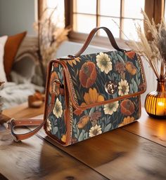 Cottagecore Boho Retro 70s Autumn Floral Canvas Satchel Bag Fashioned from durable waterproof canvas and vegan leather straps, this gorgeous cottagecore crossbody bag is just what you need for a little extra room for all of your essentials. Made from high quality materials, this cottagecore style boho bag features a secure magnetic snap closure and adjustable shoulder strap. Can be used as a nice iPad storage bag, leisure travel tote bag, crossbody messenger bag, etc. 🤎 Made from high-grade wat Cottage Core Purse, Vintage Floral Print Bag For Daily Use, Multicolor Floral Print Rectangular Shoulder Bag, Vintage Brown Bags With Floral Print, Brown Floral Print Shoulder Bag For Daily Use, Brown Rectangular Bag With Floral Print, Vintage Orange Bag As Gift, Vintage Brown Shoulder Bag With Floral Print, Vintage Orange Bag For Gift