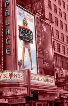 an advertisement for legally blonde on the side of a building