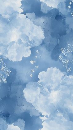 the sky is filled with clouds and white designs on blue paper, as well as an image of flowers