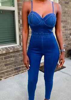 Hey hot stuff! Ready to hit the town? This dark blue denim jumpsuit is built to show off your curves! It features adjustable straps and padded bra cups to get a fit that is just right. The side cut out detail provides just enough flare to turn heads! Day or night this jumpsuit will transition! Step into your new hot look today. Model is 5'4 wearing a size Small 74% cotton, 23% polyester, 3% spandex Side cut-outs Adjustable cami straps Skinny leg Concealed back zipper closure Square cut back Unde Hey Hot Stuff, Blue Jean Jumpsuit, Plain Jane, Concert Looks, Dark Blue Denim, Denim And Lace, Side Cuts, Dark Blue Jeans, Padded Bra