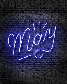 a blue neon sign that reads mary on a brick wall with the word mary written in cursive font