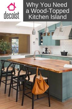 a kitchen island with chairs in it and the words, why you need a wood - topped kitchen island