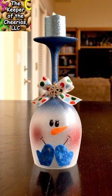 a snowman bottle sitting on top of a wooden table