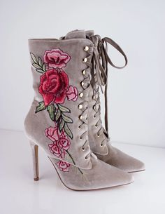 Our SISITINE booties have flowers embroidered onto its velvet outer shell and gold metal accents. Heel height: 4.2" Winter Floral Print Boots, Spring High Heel Boots With Floral Embroidery, Embroidered High Heel Boots For Spring, Party Boots With Floral Print And Pointed Toe, Fall Embroidered High Heel Boots, Elegant Party Boots With Embroidery, Party Boots With Floral Embroidery And Round Toe, Elegant Embroidered Pointed Toe Boots, Party High Heel Embroidered Boots