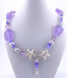 Lavender sea glass nuggets are combined with lavender sea glass beads, Czech glass beads, lavender jade, and Swarovski lavender pearls. The focal of this necklace is the sterling silver starfish clasp, which can either be worn in the front or back. Necklace is 20 inches long. Lavender Jade, Czech Glass Beads, Czech Glass, Sea Glass, Starfish, Jewelry Gift, Gift For Her, Jewelry Gifts, Glass Beads