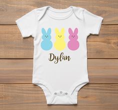 Every parent knows that you can never have too many baby onesies! Baby onesies make the perfect gift for birthdays or baby showers. These rompers are made from 100% soft polyester. Sizing: small 0-3 months, medium 3-6 months, large 6-12 months, XL 12-18 months, XXL 18-24 months Made from 100% soft polyester Cute Onesie With Name Print For Playtime, Unisex Cute Onesie For Birthday, Personalized Cute Onesie For First Birthday, Cute Pre-shrunk Onesie, Cute Unisex Pre-shrunk Onesie, Customizable Cute Bodysuit For Birthday, Customizable Cute Birthday Bodysuit, Cute Birthday Onesie With Custom Print, Cute Custom Print Birthday Onesie