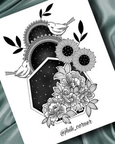 a card with flowers and two birds on it's side, in black and white