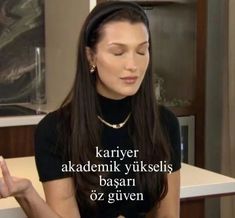 a woman sitting at a table with her eyes closed and the words karyer akademik wiksels basar oz given