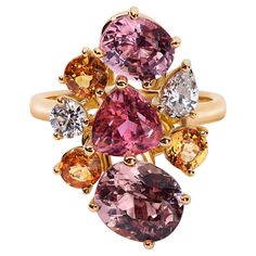 This cocktail cluster ring features a mix of expertly sourced gemstones: 2.42 ctw of Malaia garnet, 1.3 ctw of pink tourmaline, 1.48 ctw of pink spinel, 0.9 ctw of Spessartine garnets, all offset by pear and round natural GH VS diamonds. The gold is a proprietary alloy of 18k yellow and rose. It was made by a head jeweler at an iconic luxury jewelry house that Summerset often collaborates with. During his free time, this artist experiments with new techniques and metals to keep his skills sharp, Multi Gemstone Ring By Angeline, Luxury Multi-stone Cluster Ring In Sterling Silver, Luxury Multicolor Cluster Jewelry, Luxury Hallmarked Cluster Jewelry, Luxury Gold Cluster Jewelry, Luxury Modern Multi-stone Gemstones, Luxury Exquisite Gold Cluster Ring, Pink Spinel, Contemporary Ring