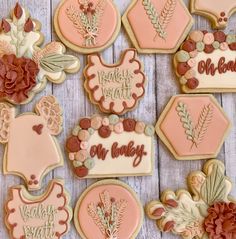 decorated cookies are arranged on a wooden table