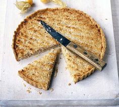 a piece of pie on a cutting board with a knife