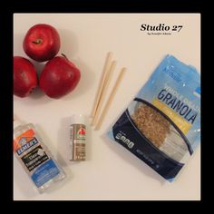 apples, chopsticks, and granola are sitting on a white counter top