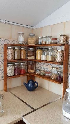 a kitchen with shelves filled with jars and containers