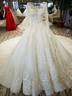 a white wedding dress on display in a store