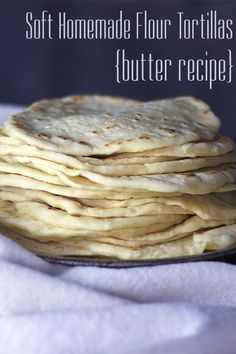 a stack of tortillas sitting on top of a white towel