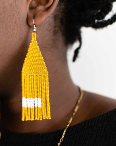 Intricate and bold, these beaded earrings have been intricately woven by artisan women in Guatemala. The mustard yellow contrasts with the white for a dramatic effect. Dimensions Beadwork is 3 1/2" | 90 mm Material seed beads, thread, and stainless steel hook Beaded Fringe Earrings, Beaded Fringe, Fringe Earrings, Mustard Yellow, Guatemala, Beaded Earrings, Bead Work, The White, Seed Beads