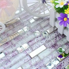 decorative mirror tiles on the floor with flowers