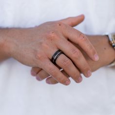 two hands holding each other with rings on their fingers