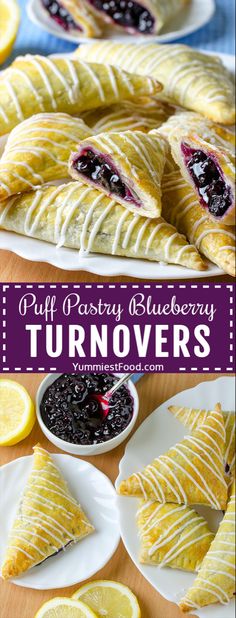 puff pastry blueberry turnovers on plates with lemon slices and blackberries in the background