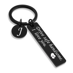 a black keychain with the words i love you and two hearts on it