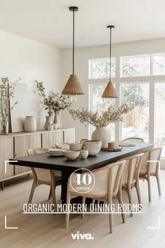 a dining room table with chairs and vases on it