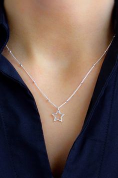 Brilliant and high polished, this 925 sterling silver star pendant necklace has a simple open work design. Choose from several chain options to make it special gift to give or a versatile accessory for yourself. Silver Star Print Necklace, Silver Necklace With Star Print For Gift, Silver Star Print Necklace For Gift, Silver Star Print Necklace Perfect For Gift, Silver Star Necklaces For Birthday, Silver Star Necklace For Birthday, Personalized Star Necklaces For Birthday Gift, Personalized Star Necklace For Birthday, Personalized Star Necklace For Birthday Gift