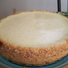 a cheesecake sitting on top of a blue plate