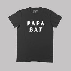 🦇 Father tees for Goth Dad🦇 Get the whole set: Mama Bat, Papa Bat, Little Bat, Baby Bat in our shop! 🦇 Buy any two items and get FREE SHIPPING. 🦇   Printed on demand for each customer order and shipped from our printing partner conveniently located near you! Whether you're within the US or abroad, we ensure prompt delivery by shipping domestically within the US or internationally from the UK, saving you transit time, shipping costs, and customs fees. Our current average fulfillment time is one week for domestic and international orders, encompassing custom printing on demand and shipping. Our tees are expertly printed on soft, high-quality, unisex, fine ring-spun 100% cotton. To maintain their quality, machine wash cold inside out with like colors and tumble dry low. Father's Day Black T-shirt With Funny Print, Unisex Black T-shirt For Father's Day, Black Unisex T-shirt For Father's Day, Baby Bats, Print Tee, Printed Tees, Halloween Shirt, Fathers Day Gifts, Fathers Day