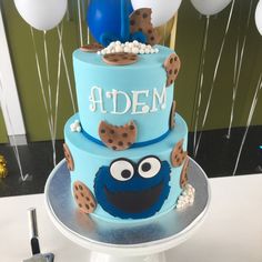 a blue cake with cookie cookies on top and an elm street sign in the middle