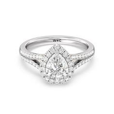 a pear shaped diamond engagement ring on a white background