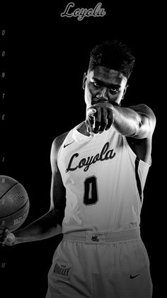 a black and white photo of a basketball player with his hand on his face holding a ball