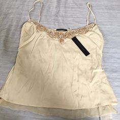 Elise Camisole Natural 95% Silk 5% Spandex $248 Retail Price Cream Silk Party Tops, Spring Gold Silk Top, Gold Fitted Cami Top, Elegant Gold Sleeveless Camisole, Gold Silk Top For Spring, Gold Silk Tops For Spring, Sleeveless Cream Silk Top, Cream Tank Camisole For Spring, Feminine Silk Top For Night Out