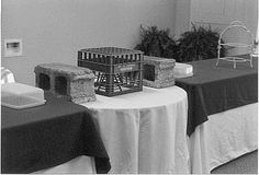 the table is set up with candles and other items for an event or wedding reception