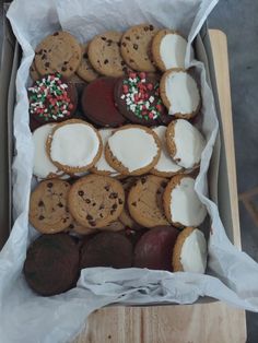 a box filled with lots of different types of cookies