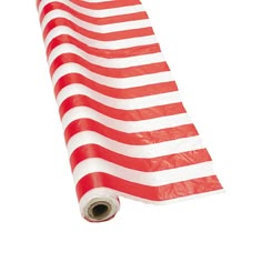 a red and white american flag laying on top of a roll of plastic wrapper