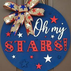 a blue sign that says oh my stars with red, white and blue stars on it