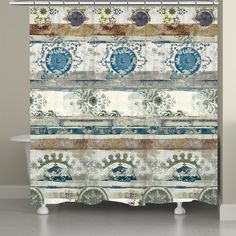 a shower curtain with an ornate design on the front and back panels in blue, green,