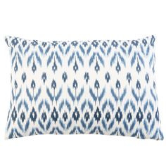 a blue and white pillow on a white background