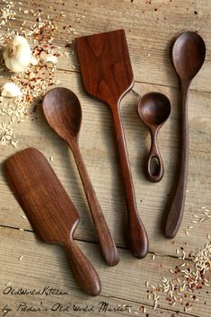 three wooden spoons, one is empty and the other two are made out of wood