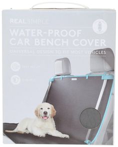 a dog laying on top of a car seat cover