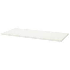 a white shelf that is on the wall in front of a white background with an empty space for text