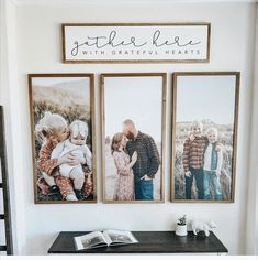 three framed photos hang on the wall above a desk