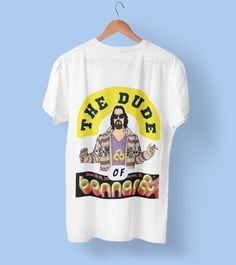 "Get ready to rock and roll in style with our exclusive The Dude Of Bonnaroo T-Shirt. Designed for true music lovers and fans of \"The Big Lebowski,\" this unique shirt brings together the best of both worlds. Crafted with style and comfort in mind, this T-shirt is made from a premium blend of fabrics that ensure a soft and breathable feel all day long. Whether you're headbanging to your favorite band or chilling like The Dude, this shirt has got you covered. The high-quality print ensures vivid colors and sharp details that won't fade, even with frequent wear. This T-shirt is a timeless keepsake, celebrating the spirit of the festival and the iconic character of The Dude. Make a statement and spark conversations wherever you go with this limited edition T-shirt. Perfect for festival enthu Outside Lands Festival, Splendour In The Grass, Rock Festival, Big Lebowski, Festival Gear, The Dude, Burning Man Festival, Rock Festivals, Festival T Shirts