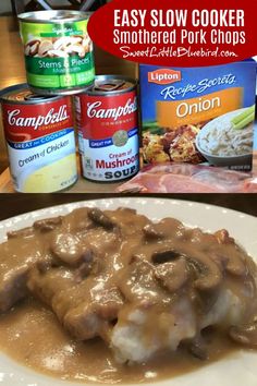 a white plate topped with meat covered in gravy next to cans of soup