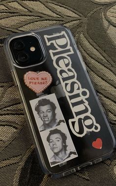 a cell phone case with some stickers on it