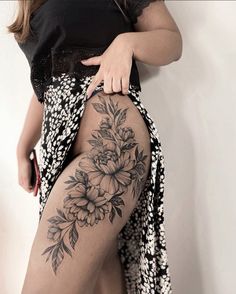 a woman's thigh with flowers on it