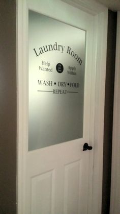 a bathroom door with the words laundry room and wash dry fold on it's side