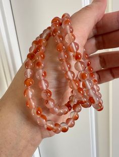 6.3mm Premium Quality Natural Sichuan BingPiao Nanhong Agate Bead Necklace/Bracelet 川料冰飘南红颈链／多圈手串 Bead Size:  6.1 - 6.3 mm Weight: app. 38.39 g Number of bead: 120 Length: 28in/72cm Natural, no dyed/no heated, Sichuan Bing Piao (Southern Red) Nanhong agate necklace/bracelet.  This is a premium quality Ping Piao Nanhong necklace/bracelet.  Its icy translucent with beautiful floating red  beads made such a gorgeous one.    Stone lines, grains, and stone skins, which are typical for agate, are not defects.  Natural gemstones are created by nature, it can not be as perfect as artificial stones.  Agate: Agate is a versatile gemstone that is often used in jewelry making. Agate is favored for its durability, with a Mohs scale hardness rating of 6.5-7. It is known for its colorful, banded patterns Carnelian Beaded Bracelets For Healing, Round 8mm Agate Beads, Agate Gemstone Beaded Bracelets, Artificial Stone, Jade Bangle, Red Agate, Agate Necklace, Red Bead, Purse Charms