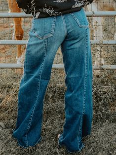 Elevate your style with our Pony Up Wide Leg Jeans. Designed with a high rise and front and back inseams, these dark denim jeans offer a trendy cowgirl look. Make a statement and enjoy the comfort and confidence of these versatile jeans. Model is 5'2 wearing size 1 Front Rise: 11.5", Inseam: 32" Western Wide Leg Jeans, Aka Jeans, Cowgirl Jeans, Cowgirl Look, She Is Clothed, Casual School Outfits, Dark Denim Jeans, Hats For Sale